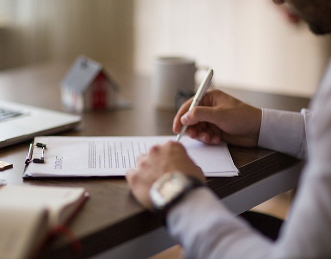 A person signing a real estate contract