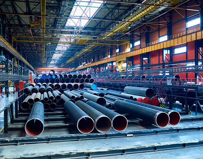 warehouse filled with industrial pipes