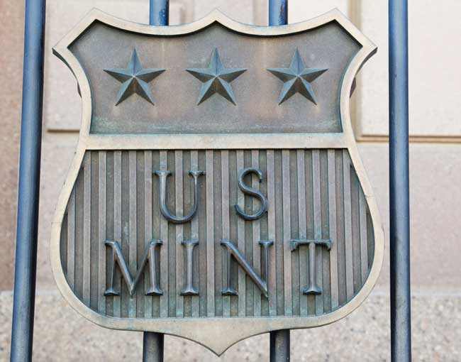 U.S. Mint shield on iron gate